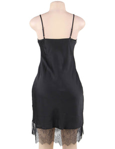 A photo of an elegant and sexy satin black nightgown with lace detail. 