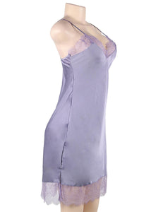 A photo of an elegant and sexy satin lavender nightgown with lace detail. 