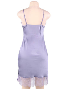 A photo of an elegant and sexy satin lavender nightgown with lace detail. 